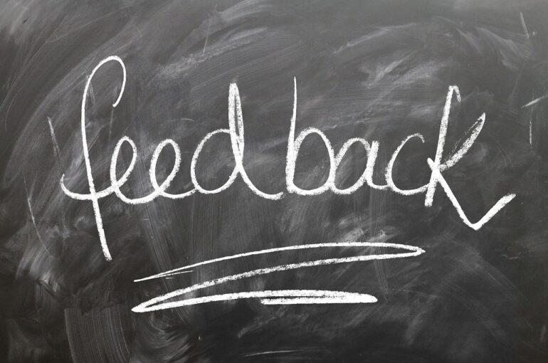 Chalkboard with the word "feedback" written on it.